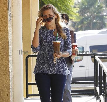 'Cougar Town' star Busy Philipps stops by Starbucks to get a large iced coffee Los Angeles.