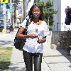 English  television presenter June Sarpong, wearing leather leggings, out and about in West Hollywood Los Angeles.