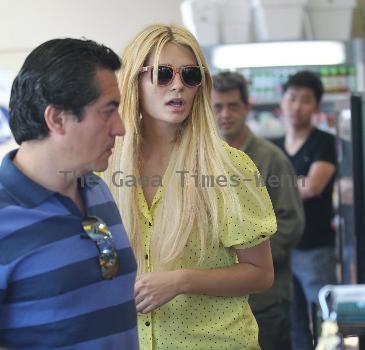 Mischa Barton stops at a gas station and buys cigarettes from a convenience store in West Hollywood Los Angeles.