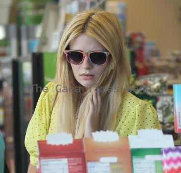 Mischa Barton stops at a gas station and buys cigarettes from a convenience store in West Hollywood Los Angeles.