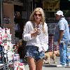 Sophie Monkhas breakfast at Kings Road Cafe wearing cut off denim shorts that appear a few sizes too large. Los Angeles.