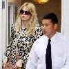 Claudia Schiffer leaving home to head for Luton airport London.