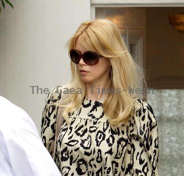 Claudia Schiffer leaving home to head for Luton airport London.