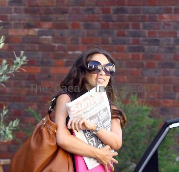 Myleene Klass carring The Sun newspaper as she leaves a studio in West London London.