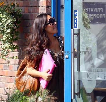 Myleene Klass carring The Sun newspaper as she leaves a studio in West London London.