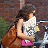 Myleene Klass carring The Sun newspaper as she leaves a studio in West London London.