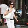 'The Good Wife' star Julianna Margulies carrying a large hat box while walking home after shopping in SoHo New York City.