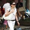 'The Good Wife' star Julianna Margulies carrying a large hat box while walking home after shopping in SoHo New York City.