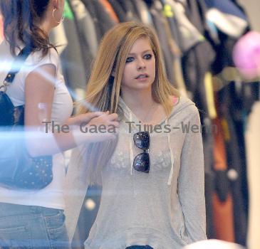 Avril Lavigne shopping at Burton Snowboards Flagship Store on Melrose Avenue Los Angeles.