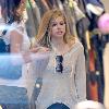 Avril Lavigne shopping at Burton Snowboards Flagship Store on Melrose Avenue Los Angeles.