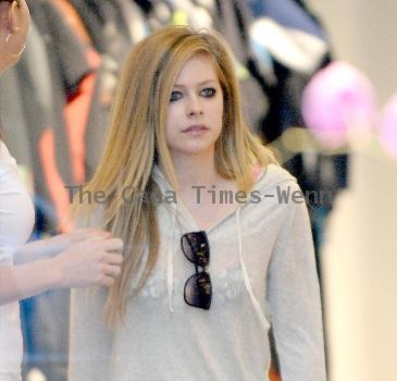 Avril Lavigne shopping at Burton Snowboards Flagship Store on Melrose Avenue Los Angeles.