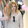 Avril Lavigne shopping at Burton Snowboards Flagship Store on Melrose Avenue Los Angeles.