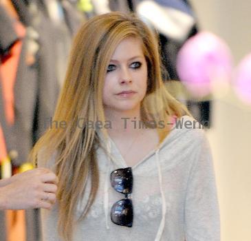 Avril Lavigne shopping at Burton Snowboards Flagship Store on Melrose Avenue Los Angeles.