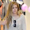 Avril Lavigne shopping at Burton Snowboards Flagship Store on Melrose Avenue Los Angeles.