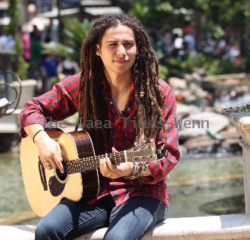 Jason Castro The former American Idol contestant performs an impromptu gig at the water fountain at The Grove, where he played two songs before continuing on his way Los Angeles.