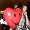 Russell Brand attends a photocall to promote 'Get Him To The Greek' at the Okura Hotel. Brand holds a heart shaped balloon given to him by his fiancee the previous eveningAmsterdam.