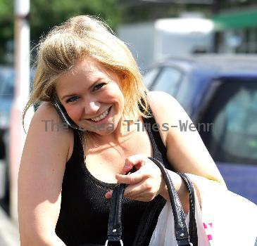 Suzanne Shaw talks on her mobile phone as she arrives at the ITV Studios Leeds.