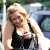 Suzanne Shaw talks on her mobile phone as she arrives at the ITV Studios Leeds.