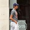 Vernon Kay arrives at the BBC Radio 1 studios to present his weekend show, wearing a Chicago Bears cap and t-shirt, white shorts and flip flops. 
London, England.