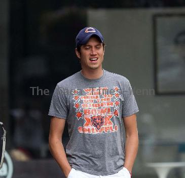 Vernon Kay arrives at the BBC Radio 1 studios to present his weekend show, wearing a Chicago Bears cap and t-shirt, white shorts and flip flops. 
London, England.