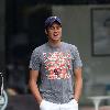 Vernon Kay arrives at the BBC Radio 1 studios to present his weekend show, wearing a Chicago Bears cap and t-shirt, white shorts and flip flops. 
London, England.