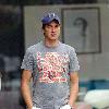 Vernon Kay arrives at the BBC Radio 1 studios to present his weekend show, wearing a Chicago Bears cap and t-shirt, white shorts and flip flops. 
London, England.