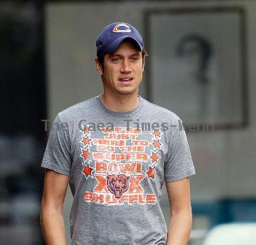 Vernon Kay arrives at the BBC Radio 1 studios to present his weekend show, wearing a Chicago Bears cap and t-shirt, white shorts and flip flops. 
London, England.