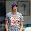 Vernon Kay arrives at the BBC Radio 1 studios to present his weekend show, wearing a Chicago Bears cap and t-shirt, white shorts and flip flops. 
London, England.