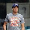 Vernon Kay arrives at the BBC Radio 1 studios to present his weekend show, wearing a Chicago Bears cap and t-shirt, white shorts and flip flops. 
London, England.