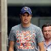 Vernon Kay arrives at the BBC Radio 1 studios to present his weekend show, wearing a Chicago Bears cap and t-shirt, white shorts and flip flops. 
London, England.