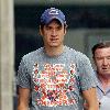 Vernon Kay arrives at the BBC Radio 1 studios to present his weekend show, wearing a Chicago Bears cap and t-shirt, white shorts and flip flops. 
London, England.