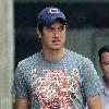 Vernon Kay arrives at the BBC Radio 1 studios to present his weekend show, wearing a Chicago Bears cap and t-shirt, white shorts and flip flops. 
London, England.