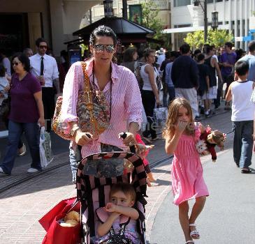 Angie Harmon takes her children shopping at The Grove Los Angeles.