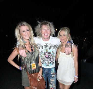 Joe Elliot of Deff Leppard spotted with a couple of female companions in Mayfair. London.