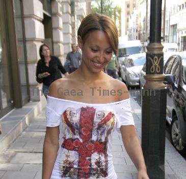 Amelle Berrabahoutside her hotel in central London wearing a Union Jack print top London.