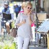 Kelly Rutherford talking on her cellphone as she arrives at Il Pastio restaurant in Beverly Hills Los Angeles.