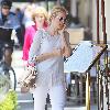 Kelly Rutherford talking on her cellphone as she arrives at Il Pastio restaurant in Beverly Hills Los Angeles.