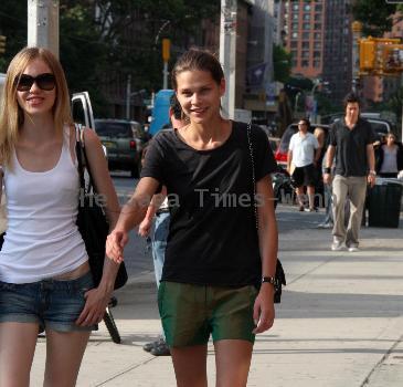 Australian supermodel, Sarah Longman seen walking through Soho with a friend. New York City.