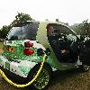Motoring writer Quentin Willson
shows off Smart's new electric car at Tower Bridge
London, England.