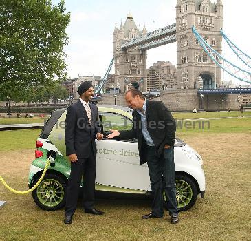 Motoring writer Quentin Willson
shows off Smart's new electric car at Tower Bridge
London, England.