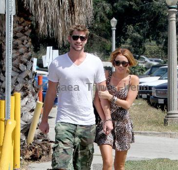 Liam Hemsworth and Miley Cyrus Miley Cyrus walking in Studio City with her boyfriend Los Angles.