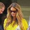 Elle Macpherson sporting a bright yellow top while out and about in London. London.