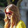 Elle Macpherson sporting a bright yellow top while out and about in London. London.