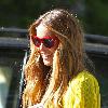 Elle Macpherson sporting a bright yellow top while out and about in London. London.