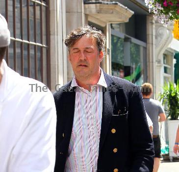 Stephen Fry
seen out walking in central London looking scruffy and unshaven. 
London, England.