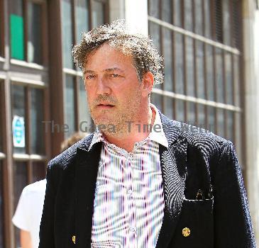 Stephen Fry
seen out walking in central London looking scruffy and unshaven. 
London, England.