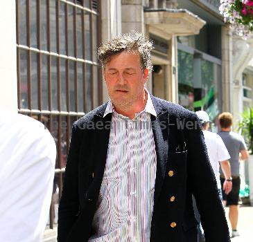 Stephen Fry
seen out walking in central London looking scruffy and unshaven. 
London, England.