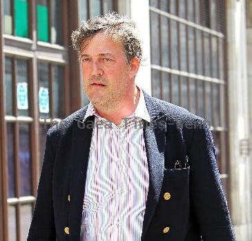 Stephen Fry
seen out walking in central London looking scruffy and unshaven. 
London, England.