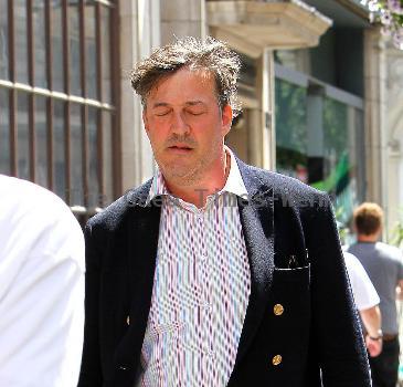 Stephen Fry
seen out walking in central London looking scruffy and unshaven. 
London, England.