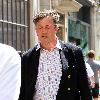 Stephen Fry
seen out walking in central London looking scruffy and unshaven. 
London, England.